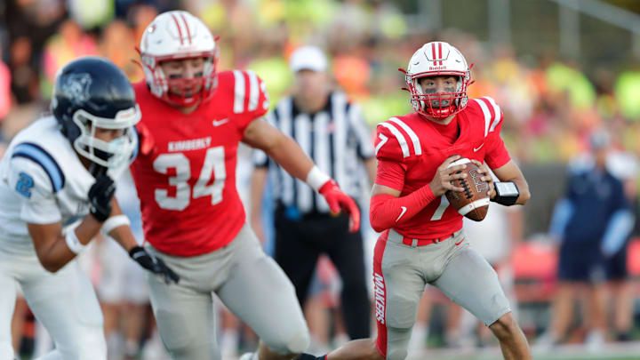 Kimberly High School's Cam Wong (7) looks to pass against Bay Port High School during their football game Thursday, August 28, 2025, in Kimberly, Wisconsin. Kimberly won 23-7.