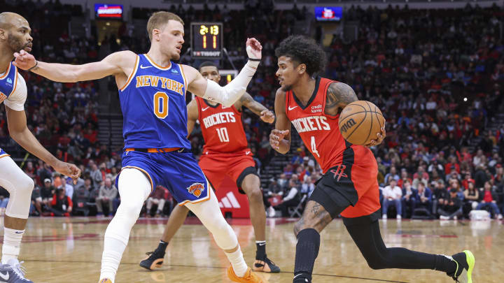 Feb 12, 2024; Houston, Texas, USA; Houston Rockets guard Jalen Green (4) controls the ball as New York Knicks guard Donte DiVincenzo (0) defends during the second quarter at Toyota Center. Mandatory Credit: Troy Taormina-USA TODAY Sports