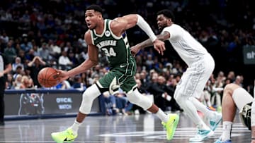Mar 1, 2025; Dallas, Texas, USA;  Milwaukee Bucks forward Giannis Antetokounmpo (34) drives to the basket past Dallas Mavericks forward Naji Marshall (13) during the second half at American Airlines Center. Mandatory Credit: Kevin Jairaj-Imagn Images