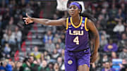 Mar 30, 2025; Spokane, WA, USA; LSU Lady Tigers guard Flau'Jae Johnson (4) reacts after play against the UCLA Bruins during the first half of a Elite 8 NCAA Tournament basketball game at Spokane Arena. Mandatory Credit: James Snook-Imagn Images