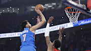 Oct 21, 2025; Oklahoma City, Oklahoma, USA; Oklahoma City Thunder center Chet Holmgren (7) shoots over Houston Rockets forward Jabari Smith Jr. (10) during the first half at Paycom Center. Mandatory Credit: Alonzo Adams-Imagn Images