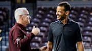 Mississippi State Director of Athletics Zac Selmon talks with Mississippi State Head Coach Brian O’Connor during his first day Dudy Noble Field at Polk-Dement Stadium in Starkville, MS. 