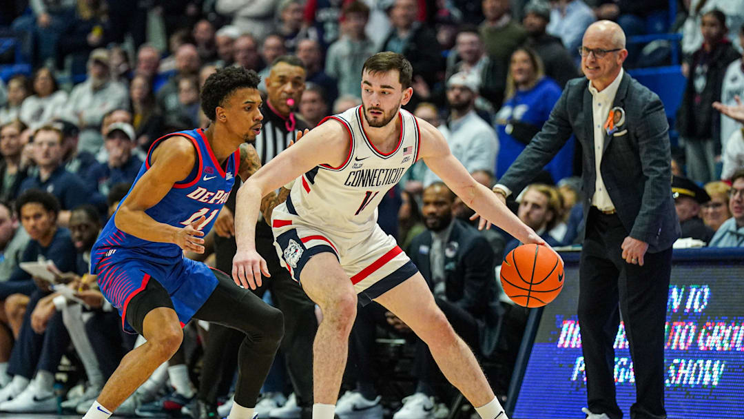 Jan 29, 2025; Hartford, Connecticut, USA; UConn Huskies forward Alex Karaban (11) moves the ball against DePaul Blue Demons guard CJ Gunn (11) in the second half at XL Center. Mandatory Credit: David Butler II-Imagn Images Jan 29, 2025; Hartford, Connecticut, USA; UConn Huskies forward Alex Karaban (11) moves the ball against DePaul Blue Demons guard CJ Gunn (11) in the second half at XL Center. Mandatory Credit: David Butler II-Imagn Images