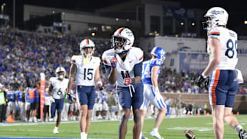 Nov 15, 2025; Durham, North Carolina, USA;  Virginia Cavaliers wide receiver Trell Harris (11) celebrates a touchdown against the Duke Blue Devils in the third quarter at Wallace Wade Stadium. Mandatory Credit: Zachary Taft-Imagn Images