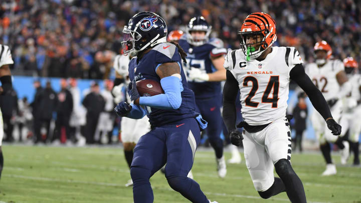 Jan 22, 2022; Nashville, Tennessee, USA; Tennessee Titans running back D'Onta Foreman (7) runs for a first down during the second half against the Cincinnati Bengals during a AFC Divisional playoff football game at Nissan Stadium. Mandatory Credit: Christopher Hanewinckel-USA TODAY Sports