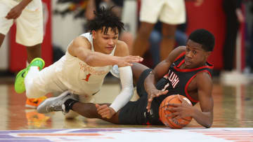 Dec 10, 2022; Scottsdale, AZ, USA; Wasatch Academy guard Isiah Harwell (left) dives for a loose ball against Long Island Lutheran guard VJ Edgecombe during the HoopHall West basketball tournament at Chaparral High School. Mandatory Credit: Mark J. Rebilas-USA TODAY Sports