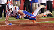 Nov 23, 2024; Fayetteville, Arkansas, USA; Louisiana Tech Bulldogs tight end Eli Finley (84) scores a touchdown in the third quarter against the Arkansas Razorbacks at Donald W. Reynolds Razorback Stadium. Arkansas won 35-14. Mandatory Credit: Nelson Chenault-Imagn Images