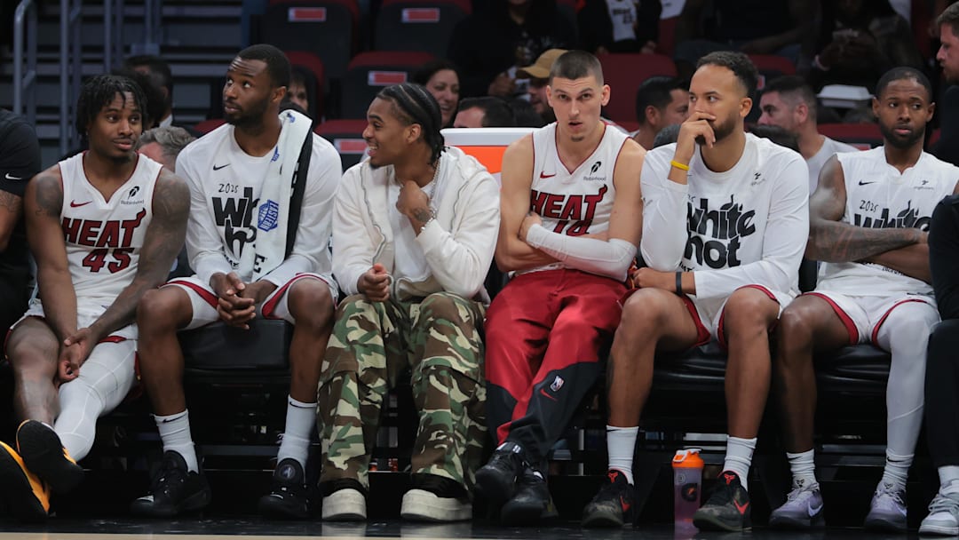 Apr 28, 2025; Miami, Florida, USA; Miami Heat guard Tyler Herro (center) looks on from the bench against the Cleveland Cavaliers in the fourth quarter during game four for the first round of the 2025 NBA Playoffs at Kaseya Center. Mandatory Credit: Sam Navarro-Imagn Images