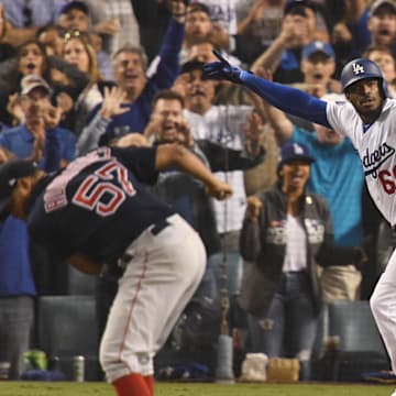 Oct 27, 2018; Los Angeles, CA, USA; Los Angeles Dodgers outfielder Yasiel Puig (66) celebrates after hitting a three-run home run off of Boston Red Sox pitcher Eduardo Rodriguez (57) in the sixth inning in game four of the 2018 World Series at Dodger Stadium. Mandatory Credit: Robert Hanashiro-Imagn Images