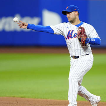 Aug 19, 2024; New York City, New York, USA; New York Mets second baseman Jose Iglesias (11) throws out Baltimore Orioles right fielder Anthony Santander (not pictured) after fielding a ground ball during the second inning at Citi Field. Mandatory Credit: Gregory Fisher-Imagn Images