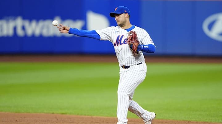 Aug 19, 2024; New York City, New York, USA; New York Mets second baseman Jose Iglesias (11) throws out Baltimore Orioles right fielder Anthony Santander (not pictured) after fielding a ground ball during the second inning at Citi Field. Mandatory Credit: Gregory Fisher-Imagn Images