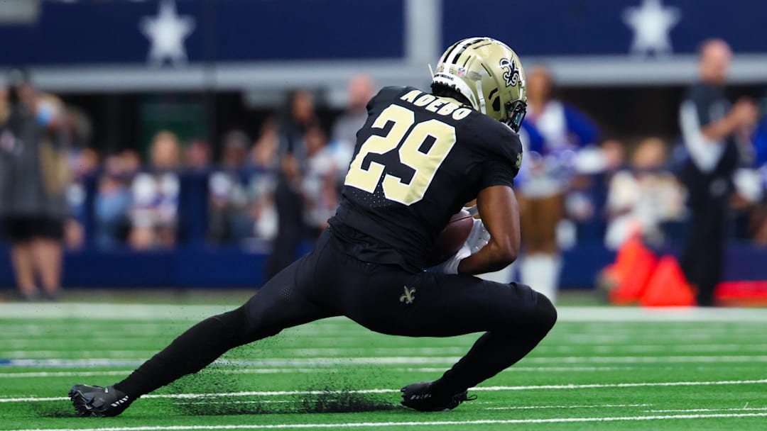 Sep 15, 2024; Arlington, Texas, USA;  New Orleans Saints cornerback Paulson Adebo (29) intercepts a ball intended for Dallas Cowboys wide receiver Jalen Brooks (not pictured) during the first half at AT&T Stadium.  