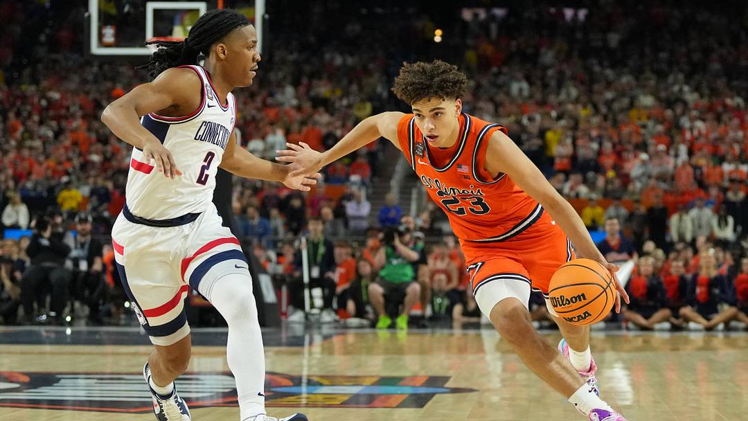 Apr 4, 2026; Indianapolis, IN, USA; Illinois Fighting Illini guard Keaton Wagler (23) dribbles the ball against UConn Huskies guard Silas Demary Jr. (2) during the first half of a semifinal of the Final Four of the men's 2026 NCAA Tournament at Lucas Oil Stadium. Mandatory Credit: Bob Donnan-Imagn Images Apr 4, 2026; Indianapolis, IN, USA; Illinois Fighting Illini guard Keaton Wagler (23) dribbles the ball against UConn Huskies guard Silas Demary Jr. (2) during the first half of a semifinal of the Final Four of the men's 2026 NCAA Tournament at Lucas Oil Stadium. Mandatory Credit: Bob Donnan-Imagn Images