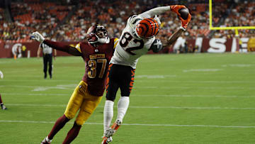 Aug 18, 2025; Landover, Maryland, USA; Cincinnati Bengals wide receiver Mitchell Tinsley (82) catches a touchdown pass as Washington Commanders cornerback Bobby Price (37) defends during the second quarter at Northwest Stadium. Mandatory Credit: Geoff Burke-Imagn Images