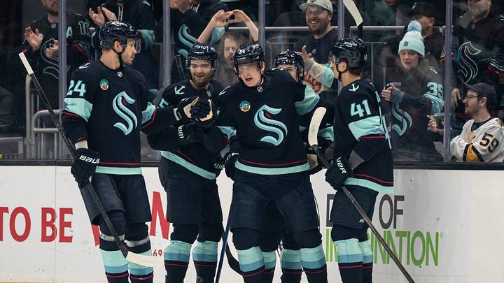 Mar 10, 2026; Seattle, Washington, USA; Seattle Kraken, from left, defenseman Jamie Oleksiak (24), forward Shane Wright (51), forward Kaapo Kakko (84), forward Berkly Catton (27) and defenseman Ryker Evans (41) celebrate a goal during the first period against the Nashville Predators at Climate Pledge Arena. Mandatory Credit: Stephen Brashear-Imagn Images