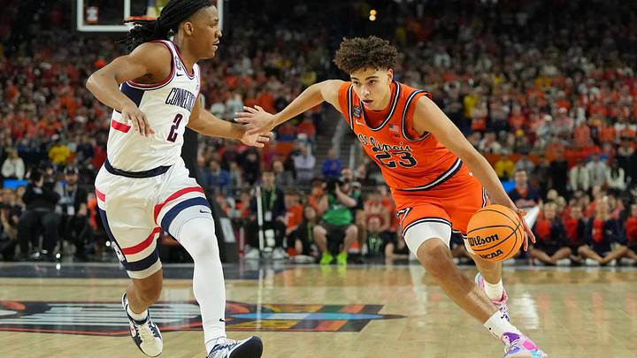 Apr 4, 2026; Indianapolis, IN, USA; Illinois Fighting Illini guard Keaton Wagler (23) dribbles the ball against UConn Huskies guard Silas Demary Jr. (2) during the first half of a semifinal of the Final Four of the men's 2026 NCAA Tournament at Lucas Oil Stadium. Mandatory Credit: Bob Donnan-Imagn Images