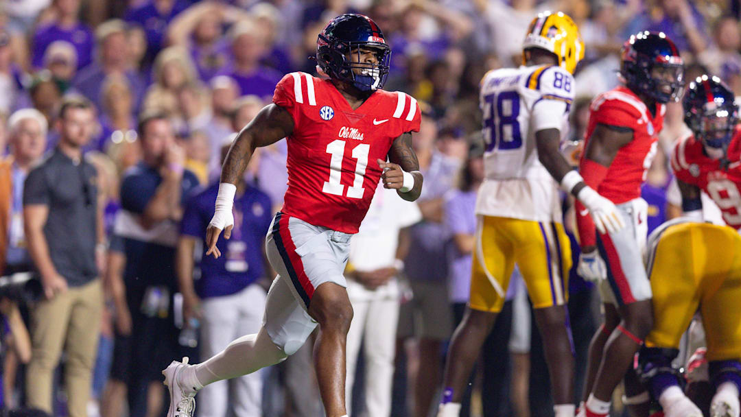 Oct 12, 2024; Baton Rouge, Louisiana, USA;  Mississippi Rebels linebacker Chris Paul Jr. (11) reacts after an interception by defensive tackle Jamarious Brown (not pictured) against the LSU Tigers during the first half at Tiger Stadium. Mandatory Credit: Stephen Lew-Imagn Images