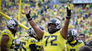 Oregon offensive lineman Iapani Laloulu celebrates a touchdown by Oregon running back Noah Whittington as the No. 1 Oregon Ducks host the No. 21 Illinois Fighting Illini Saturday, Oct. 26, 2024 at Autzen Stadium in Eugene, Ore.