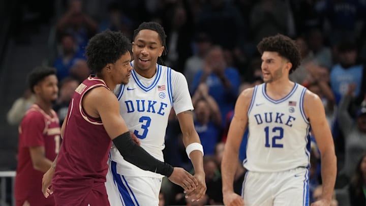 Mar 12, 2026; Charlotte, NC, USA; Florida State Seminoles guard Martin Somerville (1) and Duke basketball guard Isaiah Evans (3) react in the second half at Spectrum Center.