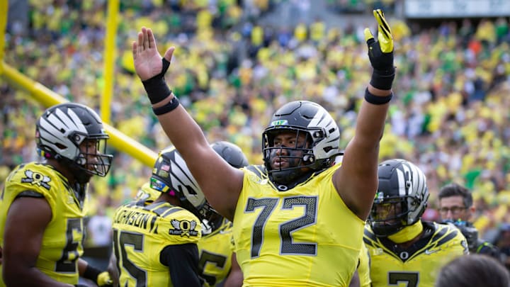 Oregon offensive lineman Iapani Laloulu celebrates a touchdown during a game earlier this season.