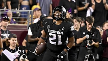 Oct 26, 2024; College Station, Texas, USA; Texas A&M Aggies linebacker Taurean York (21) reacts after catching the ball for an interception in the fourth quarter against the LSU Tigers at Kyle Field. Mandatory Credit: Maria Lysaker-Imagn Images. 