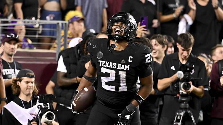 Oct 26, 2024; College Station, Texas, USA; Texas A&M Aggies linebacker Taurean York (21) reacts after catching the ball for an interception in the fourth quarter against the LSU Tigers at Kyle Field. Mandatory Credit: Maria Lysaker-Imagn Images. 