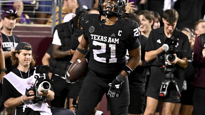 Oct 26, 2024; College Station, Texas, USA; Texas A&M Aggies linebacker Taurean York (21) reacts after catching the ball for an interception in the fourth quarter against the LSU Tigers at Kyle Field. Mandatory Credit: Maria Lysaker-Imagn Images. 