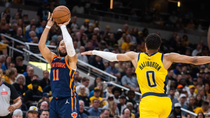 May 12, 2024; Indianapolis, Indiana, USA; New York Knicks guard Jalen Brunson (11) shoots the ball while Indiana Pacers guard Tyrese Haliburton (0) defends during game four of the second round for the 2024 NBA playoffs at Gainbridge Fieldhouse. Mandatory Credit: Trevor Ruszkowski-USA TODAY Sports