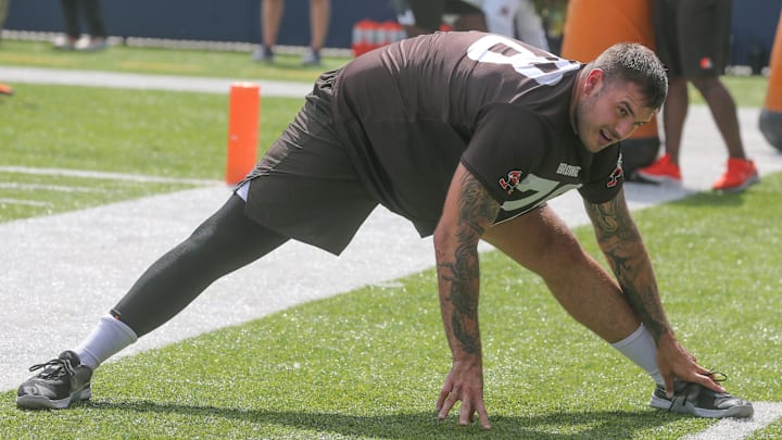 Cleveland Browns offensive lineman Jack Conklin stretches before minicamp on Wednesday, June 15, 2022 in Canton, Ohio, at Tom Benson Hall of Fame Stadium.

Browns Hof 3