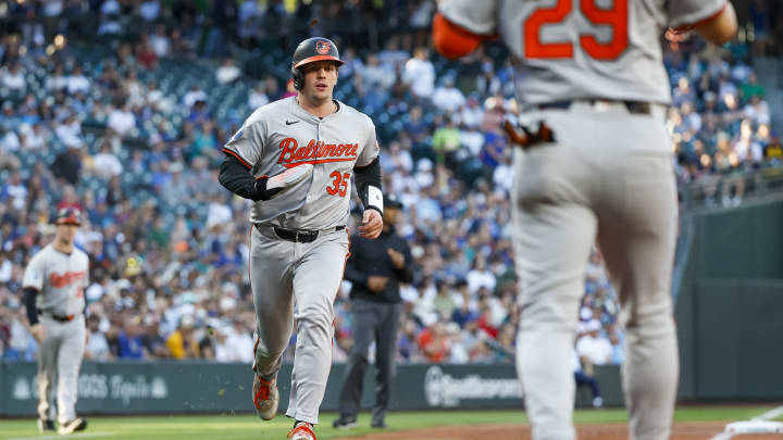 Jul 3, 2024; Seattle, Washington, USA; Baltimore Orioles catcher Adley Rutschman (35) scores a run against the Seattle Mariners during the third inning at T-Mobile Park.