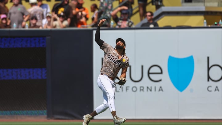 San Diego Padres right fielder Fernando Tatis Jr. (23) loses a fly ball in the sun resulting in a double to San Francisco Giants center fielder Heliot Ramos (17) during the fourth inning at Petco Park on Sept 8.