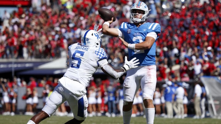 Oct 1, 2022; Oxford, Mississippi, USA; Mississippi Rebels quarterback Jaxson Dart (2) passes the ball as Kentucky Wildcats linebacker DeAndre Square (5) defends during the fourth quarter at Vaught-Hemingway Stadium. Mandatory Credit: Petre Thomas-USA TODAY Sports