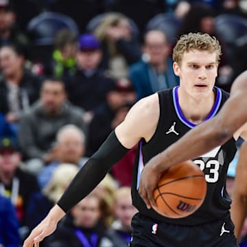 Feb 13, 2025; Salt Lake City, Utah, USA; Utah Jazz forward/center Lauri Markkanen (23) defends LA Clippers guard James Harden (1) during the first half at the Delta Center. Mandatory Credit: Christopher Creveling-Imagn Images