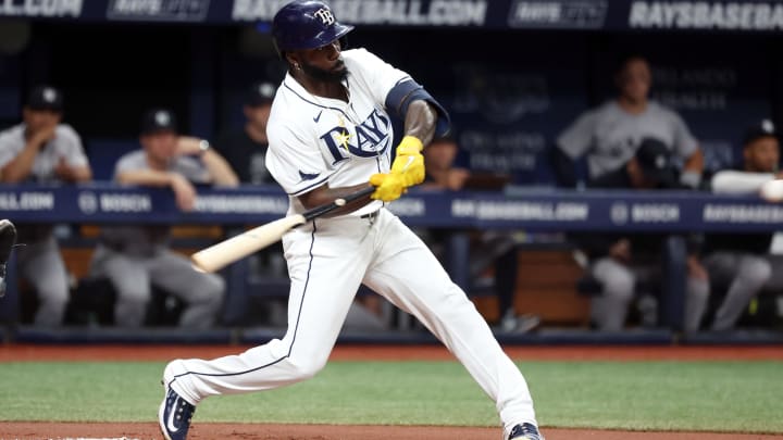 Jul 9, 2024; St. Petersburg, Florida, USA;  Tampa Bay Rays outfielder Randy Arozarena (56) hits a RBI double against the New York Yankees during the first inning at Tropicana Field. Mandatory Credit: Kim Klement Neitzel-USA TODAY Sports