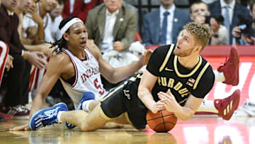 Feb 23, 2025; Bloomington, Indiana, USA; Purdue Boilermakers forward Caleb Furst (1) calls a timeout in front of Indiana Hoosiers forward Malik Reneau (5) during the first half at Simon Skjodt Assembly Hall. Mandatory Credit: Robert Goddin-Imagn Images