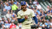 Sep 4, 2025; Milwaukee, Wisconsin, USA;  Milwaukee Brewers starting pitcher Freddy Peralta (51) reacts after striking out Philadelphia Phillies third baseman Alec Bohm (not pictured) with the bases loaded in the fourth inning at American Family Field. Mandatory Credit: Benny Sieu-Imagn Images