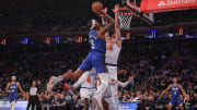 Jan 15, 2024; New York, New York, USA; Orlando Magic forward Paolo Banchero (5) goes to the basket as New York Knicks center Isaiah Hartenstein (55) defends during the first half at Madison Square Garden. 