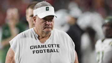 Sep 9, 2023; College Park, Maryland, USA; Charlotte 49ers head coach Biff Poggi walks the sidelines during the first half against the Maryland Terrapins  at SECU Stadium. Mandatory Credit: Tommy Gilligan-Imagn Images