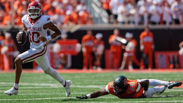 Arkansas quarterback Taylen Green avoids the Oklahoma State rush.