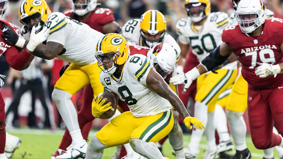 Josh Jacobs runs with the ball.