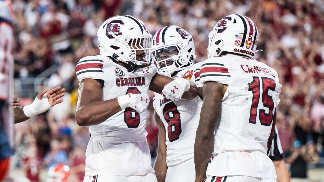 Dec 31, 2024; Orlando, FL, USA; South Carolina Gamecocks running back Dylan Stewart (6) and wide receiver Dalevon Campbell (15)celebrates his touchdown against the Illinois Fighting Illini in the fourth quarter at Camping World Stadium. Mandatory Credit: Jeremy Reper-Imagn Images Dec 31, 2024; Orlando, FL, USA; South Carolina Gamecocks running back Dylan Stewart (6) and wide receiver Dalevon Campbell (15)celebrates his touchdown against the Illinois Fighting Illini in the fourth quarter at Camping World Stadium. Mandatory Credit: Jeremy Reper-Imagn Images