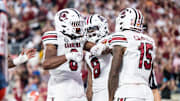 Dec 31, 2024; Orlando, FL, USA; South Carolina Gamecocks running back Dylan Stewart (6) and wide receiver Dalevon Campbell (15)celebrates his touchdown against the Illinois Fighting Illini in the fourth quarter at Camping World Stadium. Mandatory Credit: Jeremy Reper-Imagn Images