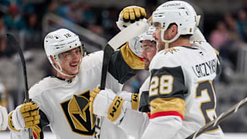Sep 26, 2025; San Jose, California, USA; Vegas Golden Knights defenseman Lukas Cormier (51, center) celebrates with center Jakub Brabenec (12) and center Tanner Laczynski (28) after scoring the game-winning power play goal against the San Jose Sharks during the third period at SAP Center at San Jose. Mandatory Credit: Robert Edwards-Imagn Images