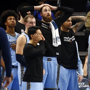 Nov 19, 2024; Memphis, Tennessee, USA; Memphis Grizzlies guard Ja Morant (left) and the Grizzlies bench react during the second half against the Denver Nuggets at FedExForum. Mandatory Credit: Petre Thomas-Imagn Images