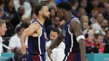 Aug 3, 2024; Villeneuve-d'Ascq, France; United States guard Anthony Edwards (5) celebrates with shooting guard Stephen Curry (4) after a basket in the fourth quarter against Puerto Rico during the Paris 2024 Olympic Summer Games at Stade Pierre-Mauroy.