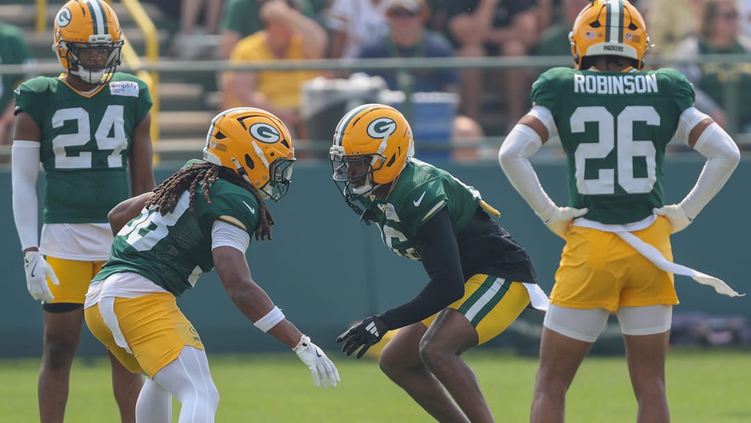 Green Bay cornerbacks Gregory Junior (28) and Bo Melton (16) run through a drill during practice on Thursday, July 31, 2025, at Ray Nitschke Field in Ashwaubenon, Wis. 
Tork Mason/USA TODAY NETWORK-Wisconsin