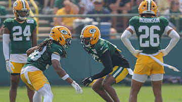 Green Bay cornerbacks Gregory Junior (28) and Bo Melton (16) run through a drill during practice on Thursday, July 31, 2025, at Ray Nitschke Field in Ashwaubenon, Wis. 
Tork Mason/USA TODAY NETWORK-Wisconsin