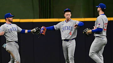 May 3, 2025; Milwaukee, Wisconsin, USA;  Chicago Cubs left fielder Ian Happ (8), center fielder Pete Crow-Armstrong (4) and right fielder Kyle Tucker (30) celebrate after beating the Milwaukee Brewers at American Family Field. 