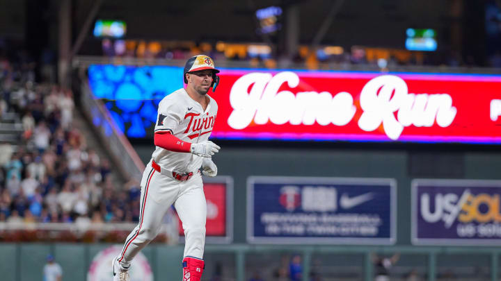 Minnesota Twins second baseman Kyle Farmer (12) celebrates his home run against the Kansas City Royals in the seventh inning at Target Field in Minneapolis on Aug. 13, 2024.