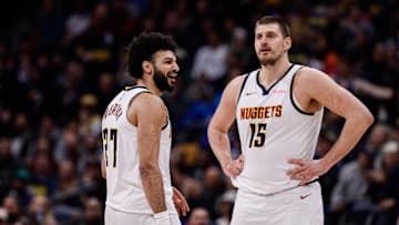 Feb 10, 2025; Denver, Colorado, USA; Denver Nuggets guard Jamal Murray (27) reacts after a call as center Nikola Jokic (15) looks on in the third quarter against the Portland Trail Blazers at Ball Arena. Mandatory Credit: Isaiah J. Downing-Imagn Images